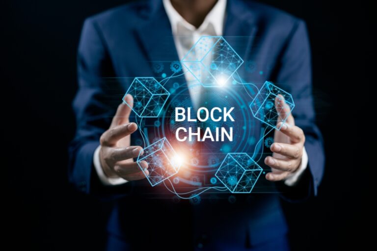 A,Businessman,Connecting,To,Blockchain,Global,Networking,,Token,Money,Bank