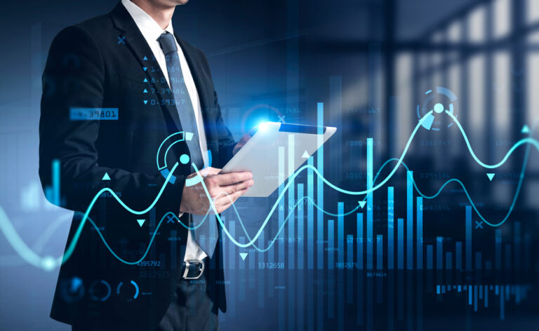 Businessman,Using,Tablet,With,Business,Report,Hologram.,Business,And,Financial