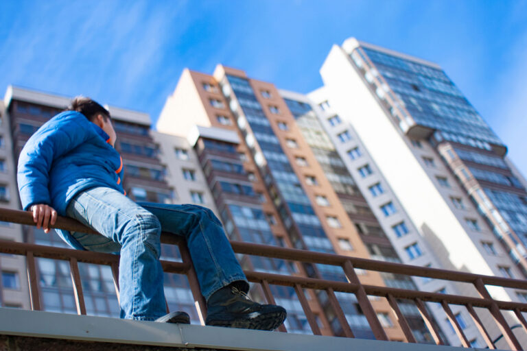 Our,New,Home.,A,Teenage,Boy,Sits,Outside,On,The