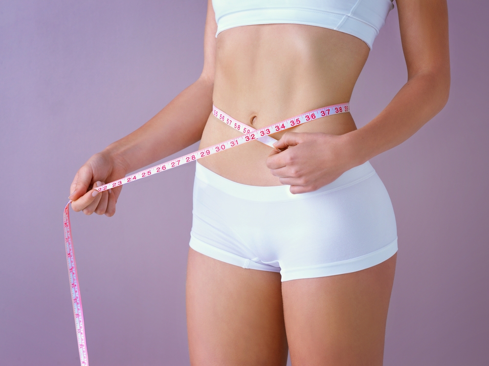 Woman,,Body,And,Waist,With,Tape,Measure,In,Studio,For