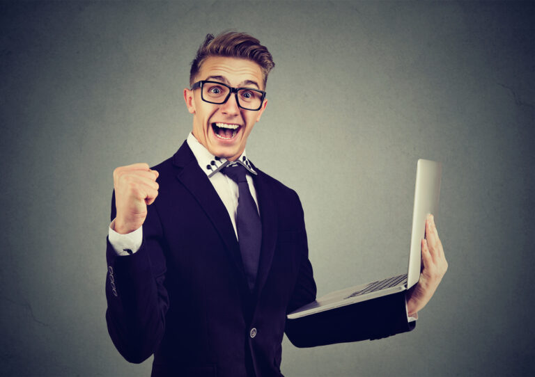 Successful,Young,Man,Using,Laptop,Building,Online,Business,Celebrating,Success.