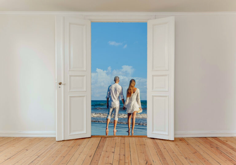 A,Married,Couple,On,The,Beach,Seen,Through,An,Open