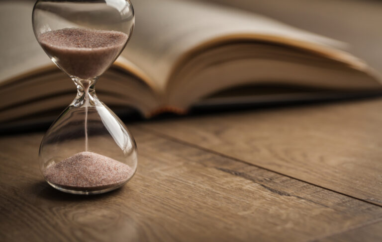 Hourglass,Countdown,With,A,Book.,Hourglass,And,Open,Bible,Symbolizing