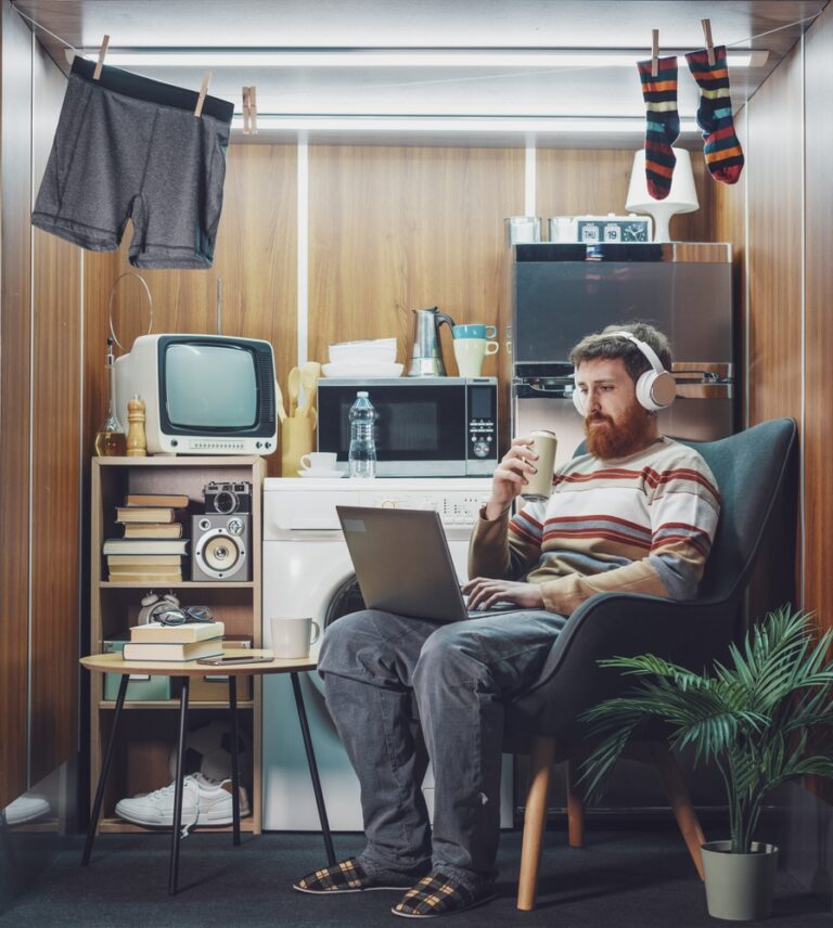 Man,Living,Alone,In,A,Stuffed,One-room,Micro,Apartment,,He