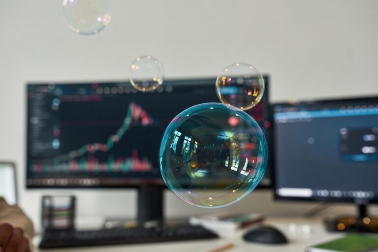 Close,Up,Crop,Soap,Bubbles,On,Forefront,,Computer,On,Background.