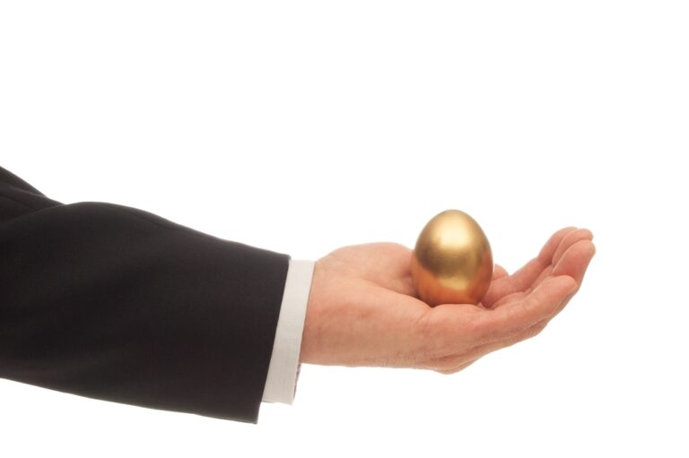 Man's,Hand,With,A,Golden,Egg,Nested,In,His,Palm