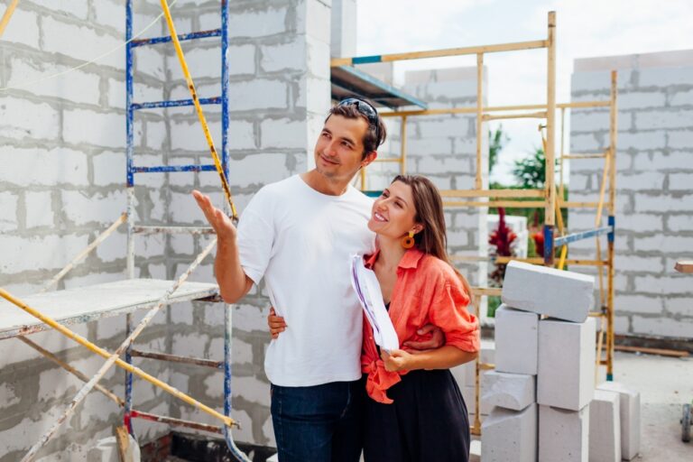 Happy,Young,Couple,Checking,Their,Future,House,Under,Construction.,Family