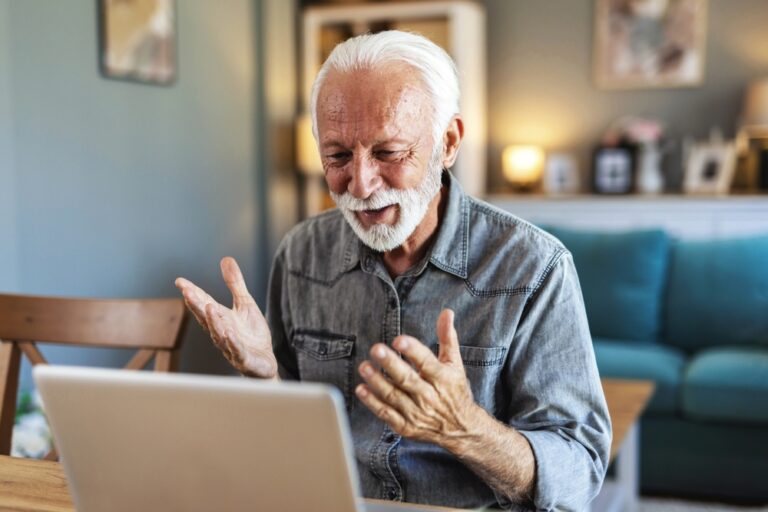Senior,Man,And,Video,Call,On,Laptop,In,Home,For