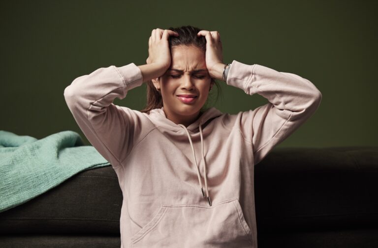 Woman,,Frustrated,And,Headache,On,Sofa,For,Mental,Health,With