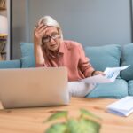 Senior,Woman,Shocked,By,Unexpectedly,High,Utility,Bill,While,Checking