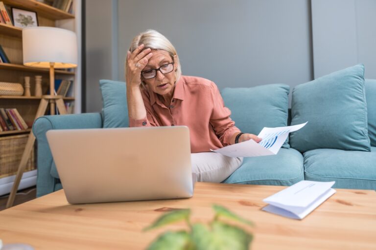 Senior,Woman,Shocked,By,Unexpectedly,High,Utility,Bill,While,Checking