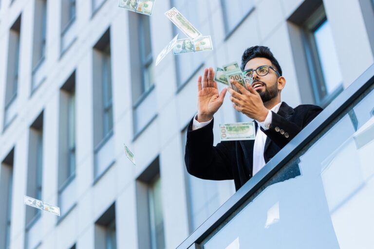 Happy,Rich,Indian,Businessman,Wasting,Throwing,Money,Dollars,Cash,Around