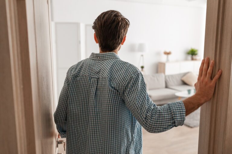 Back,Rear,View,Of,Unrecognizable,Young,Man,Walking,In,His