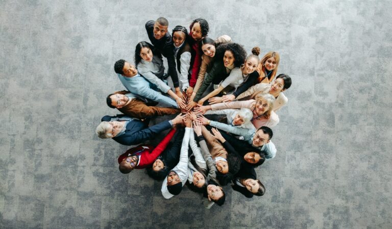 Top,View,Of,A,Diverse,Team,Of,People,Joining,Hands