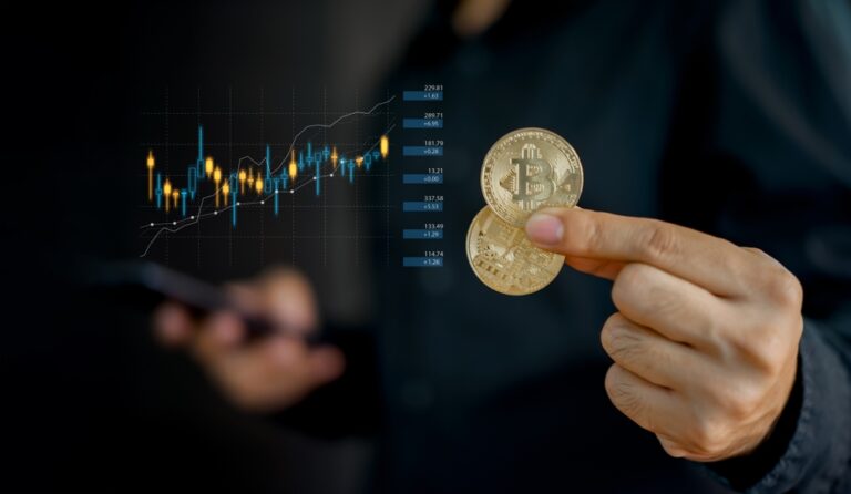 Businesswoman,,Investor,,Trader,Hold,Bitcoin,Cryptocurrency,,Using,Mobile,With,Graph
