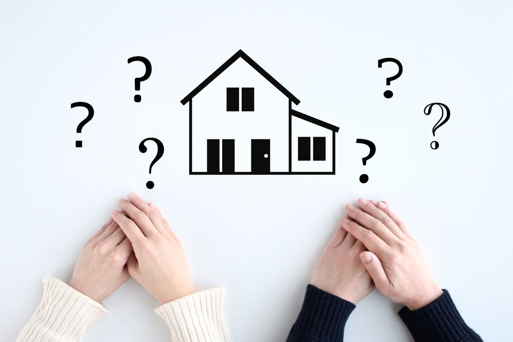 Image,Of,A,Couple,With,Questions,About,Building,A,House
