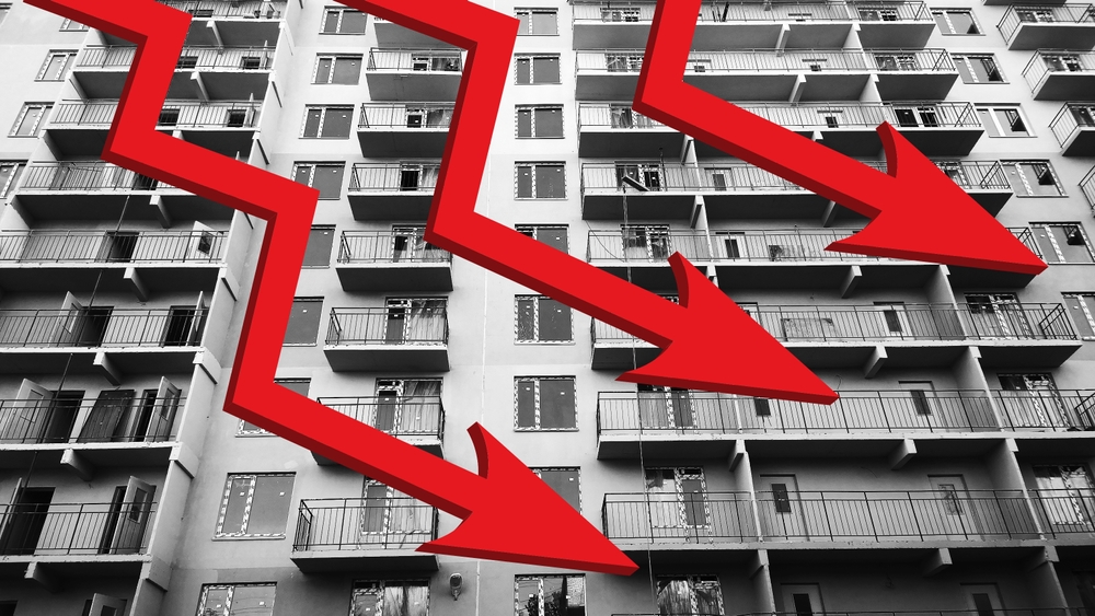 Three,Red,Down,Arrow,Sign,On,Background,Of,New,Residential