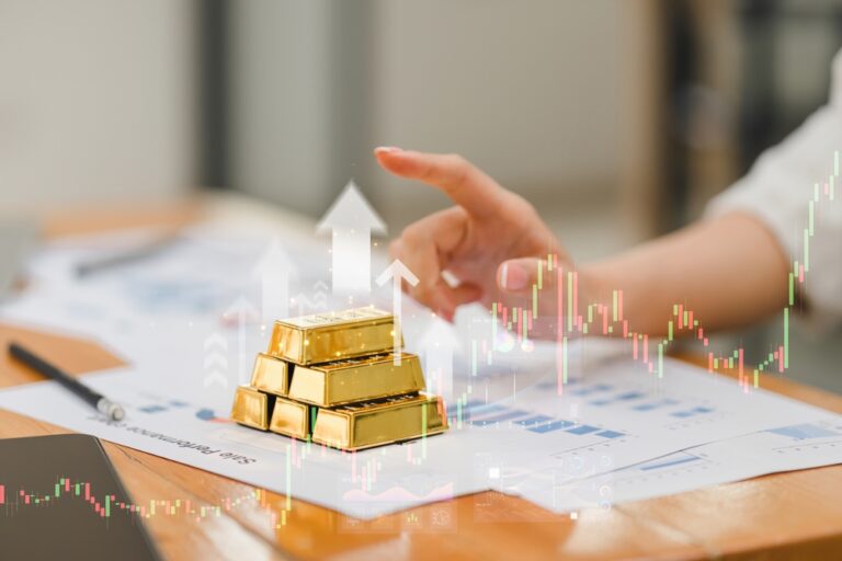 Investing,In,Gold,Bars,With,Financial,Charts,And,Graphs,In