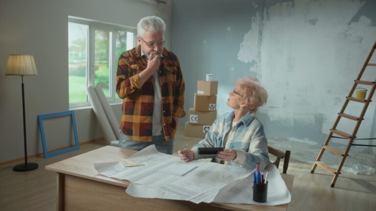Elderly,Man,And,Woman,Are,Calculating,Expenses,Of,Repairing,An