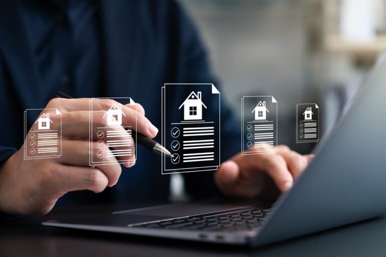 Businessman,Reviewing,Real,Estate,Documents,On,Laptop,,Symbolizing,Online,Property