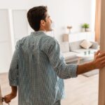 Rear,Back,View,Of,Excited,Young,Man,Walking,In,His