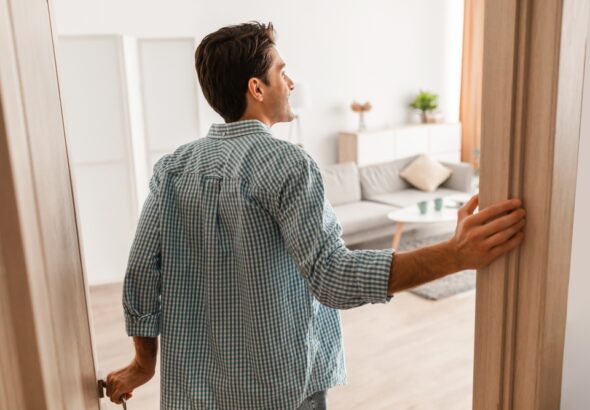 Rear,Back,View,Of,Excited,Young,Man,Walking,In,His