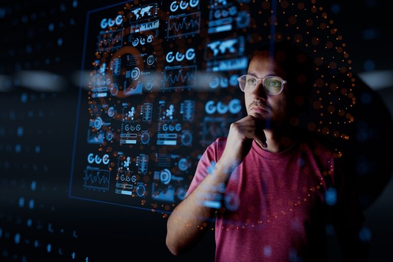 Man,Look,At,The,Dashboard,With,Graphs,And,Charts.,Concept