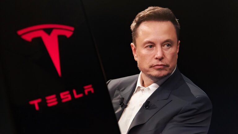 Focused,Shot,Capturing,Elon,Musk,Alongside,The,Tesla,Logo,,Symbolizing