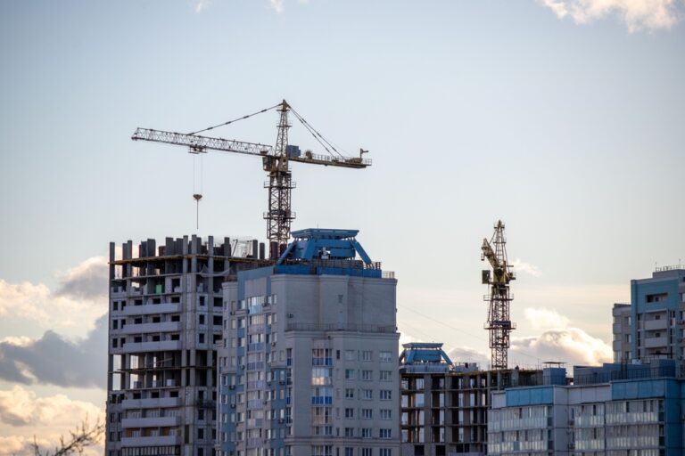 A,Construction,Site,With,A,Crane,In,The,Background.,The