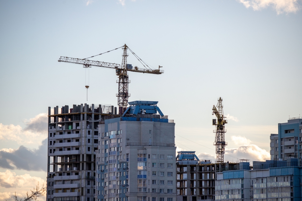 A,Construction,Site,With,A,Crane,In,The,Background.,The