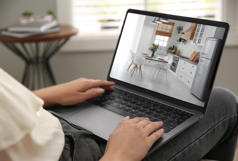 Woman,Looking,For,House,On,Real,Estate,Market,Website,At