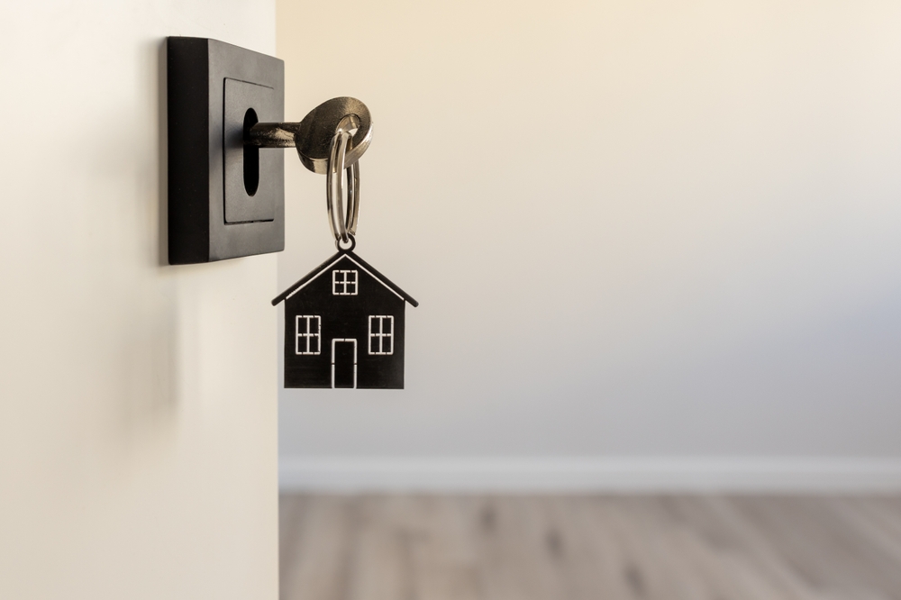 A,Key,In,A,Modern,Door,Lock,With,A,House-shaped