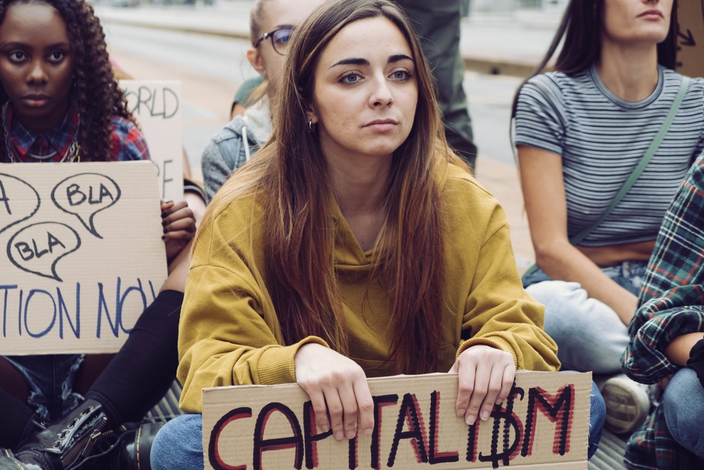 Representation,Of,Young,Activists,Participating,In,An,Anti-capitalism,Protest,,Holding