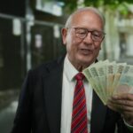 Senior,Man,Holding,Czech,Koruna,Banknotes,In,Business,Attire,On