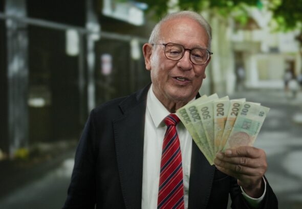 Senior,Man,Holding,Czech,Koruna,Banknotes,In,Business,Attire,On