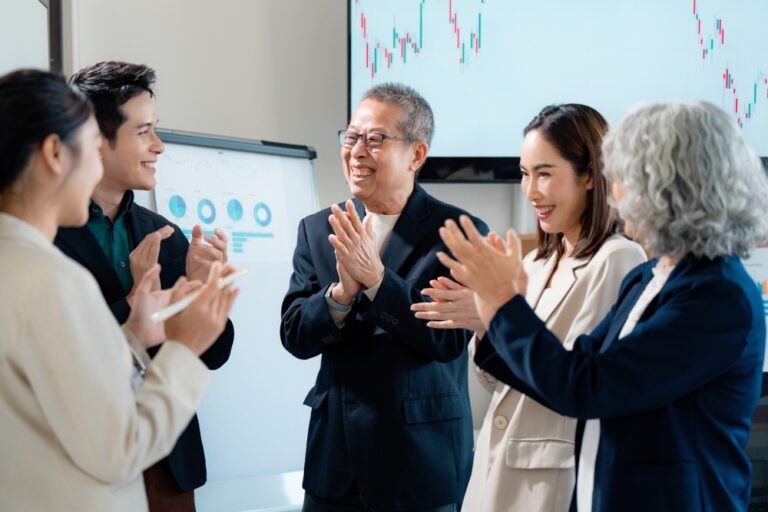 Colleagues,Applauding,,Sharing,Excitement,After,Achieving,Corporate,Milestone,In,Workplace