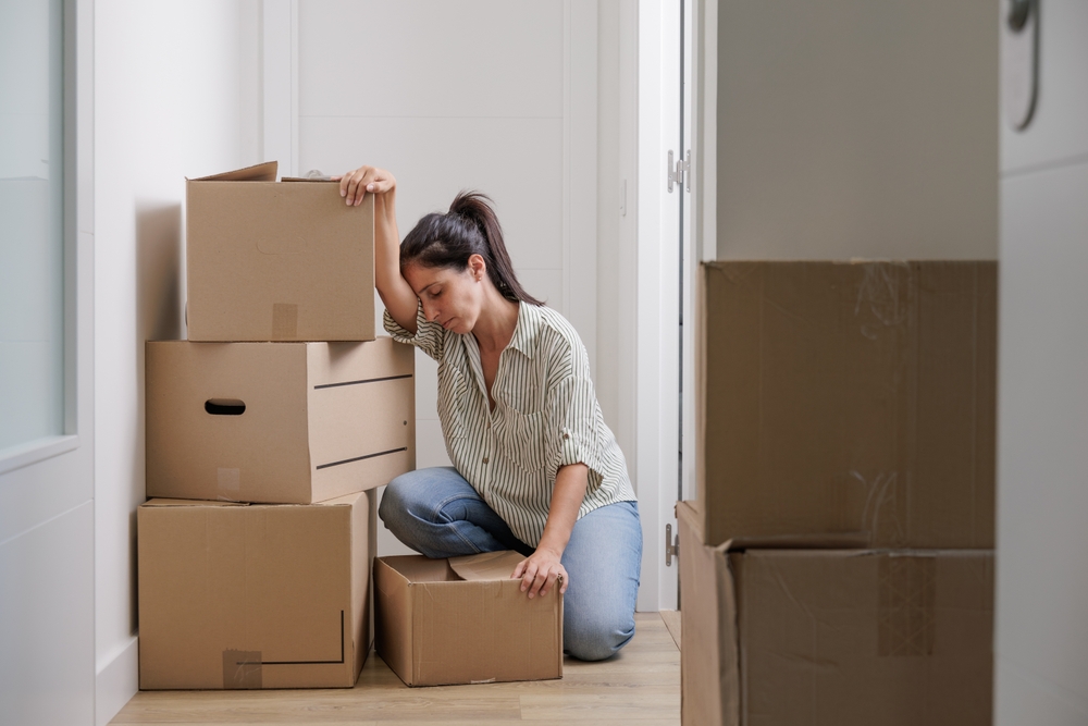 Pretty,Single,Young,Woman,Tired,Of,Carrying,Moving,Boxes,In