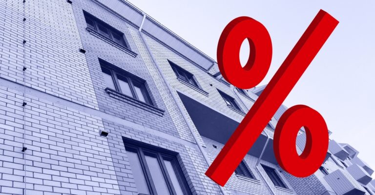 Large,Red,3d,Percentage,Sign,On,New,Multi-story,Residential,Building