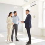Real,Estate,Agent,Or,Realtor,Guides,A,Clients,Couple,Through