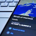 The,Phone,Screen,Displays,A,Map,Showing,The,Location,Of