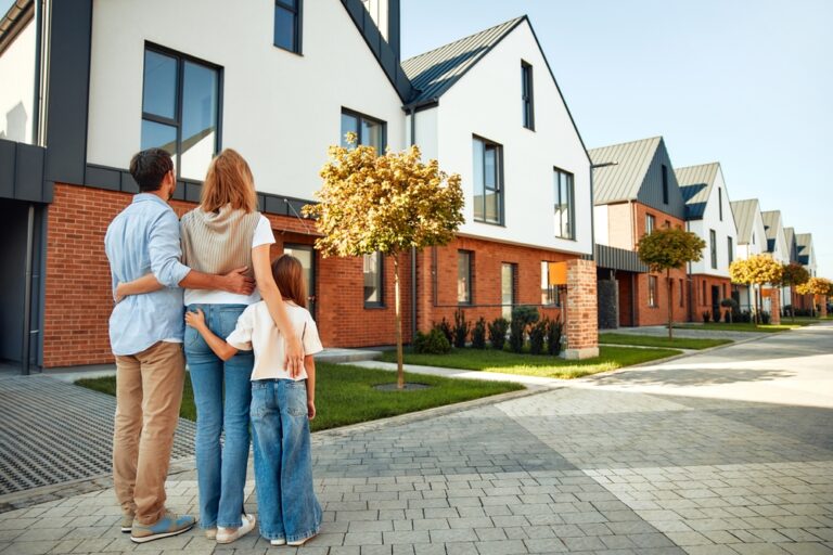 A,Young,Happy,Family,With,A,Child,Hugging,Each,Other