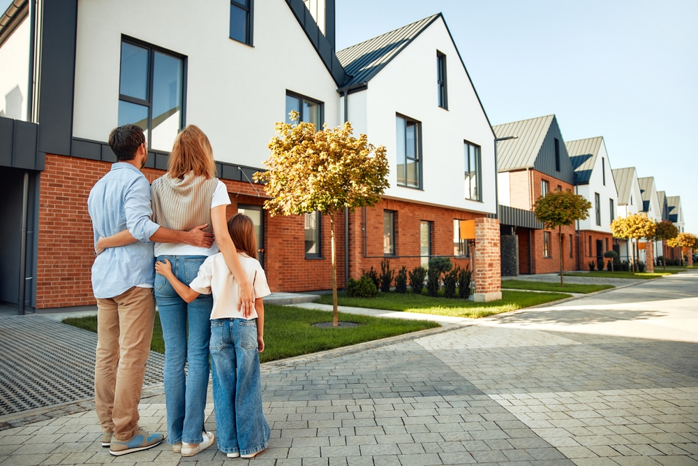 A,Young,Happy,Family,With,A,Child,Hugging,Each,Other