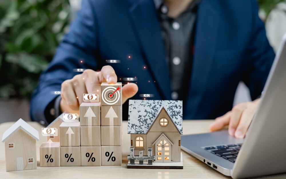 Businessman,Explores,Real,Estate,Investment,Goals,,Mortgage,Planning,,And,Interest