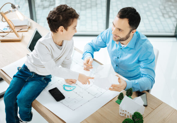 Childlike,Curiosity.,Sweet,Little,Boy,Sitting,On,The,Table,In