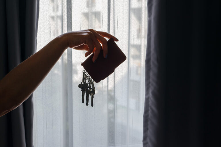 Asian,Female,Hand,Holding,Leather,Key,Holder,With,Backlight,And