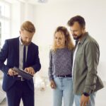 Reaching,Agreement.,Excited,Young,Married,Couple,Of,Clients,Going,To