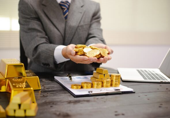 Illustration,Of,Businessman,Working,Hard,With,Gold,Bars,,Evaluating,Investments