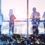 Colleages,Standing,On,Abstract,Illuminated,City,Background,With,Forex,Chart.