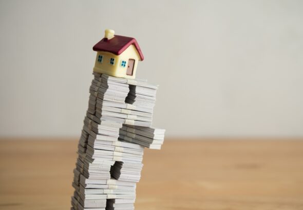 Model,House,On,Us,Dollar,Banknotes,With,White,Wall,Background