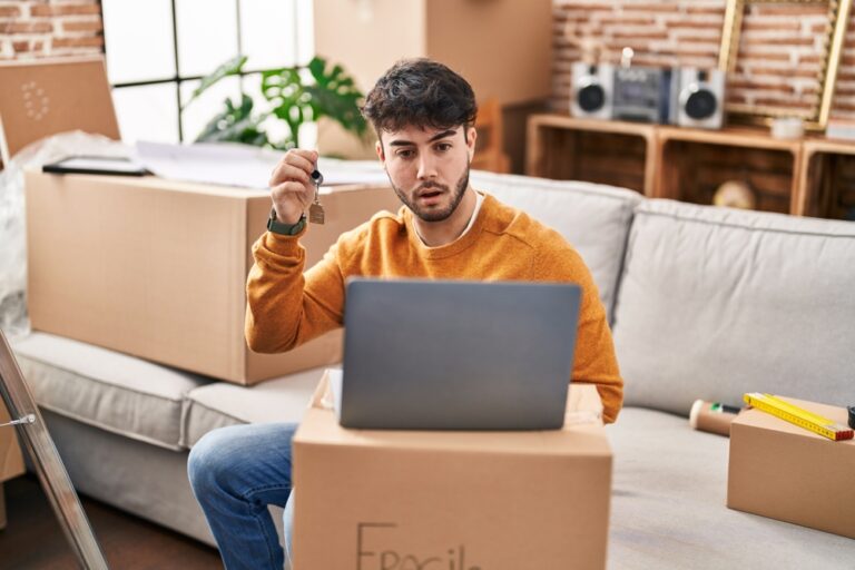 Hispanic,Man,With,Beard,Holding,Keys,Of,New,Home,Doing